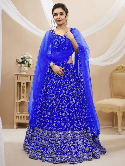 Mesmerizing Blue Sequins Georgette Wedding Wear Lehenga Choli